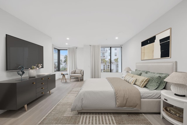 201 SE 4th Ave, Delray Beach, FL 33483 - bedroom featuring light wood-style flooring and recessed lighting