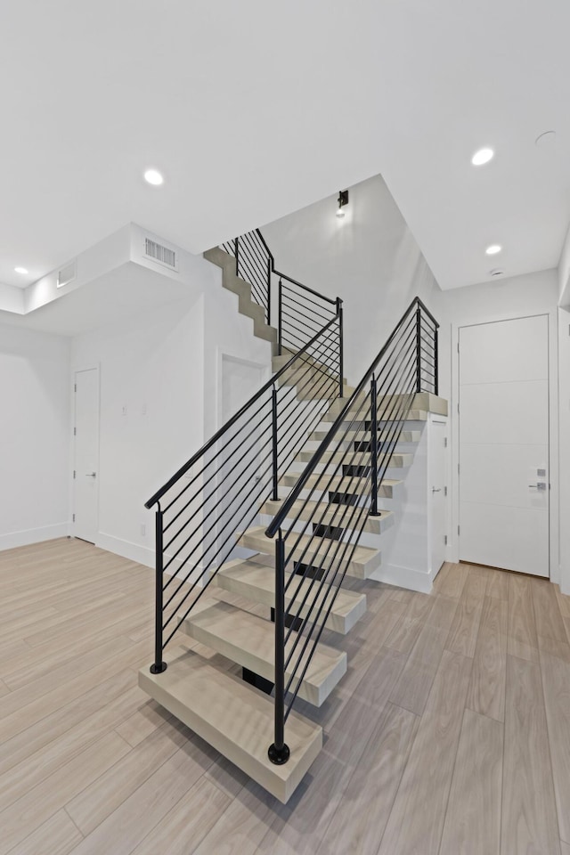 201 SE 4th Ave, Delray Beach, FL 33483 - staircase with wood finished floors, recessed lighting, and baseboards