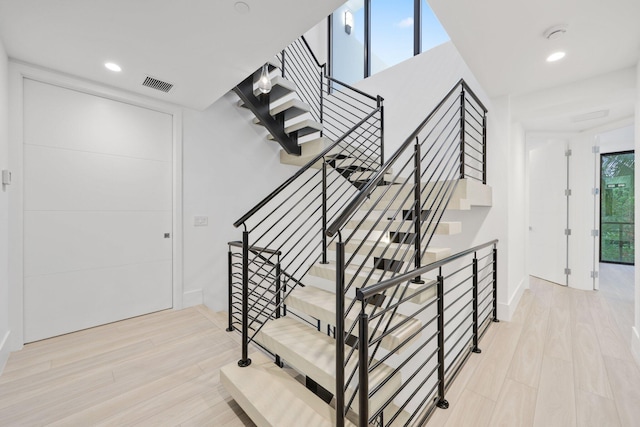 201 SE 4th Ave, Delray Beach, FL 33483 - stairway with wood finished floors and recessed lighting