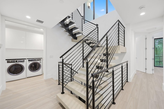 201 SE 4th Ave, Delray Beach, FL 33483 - stairway with washer and clothes dryer, wood finished floors, recessed lighting, and baseboards