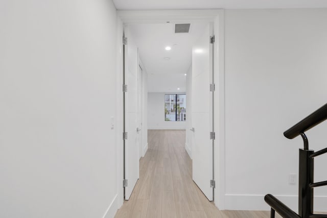 201 SE 4th Ave, Delray Beach, FL 33483 - hallway featuring light wood-type flooring, baseboards, and recessed lighting