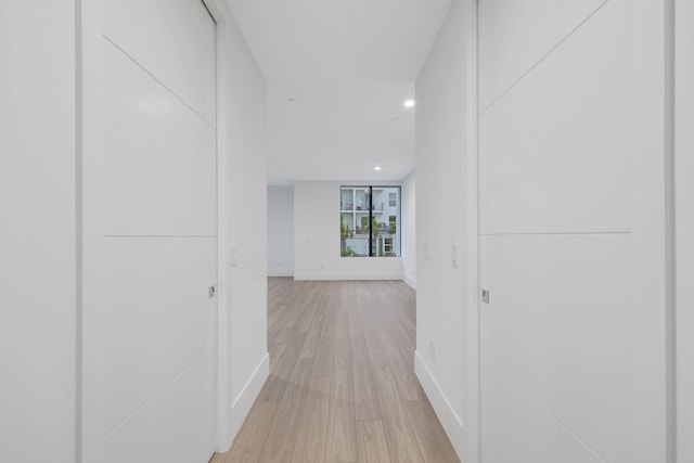 201 SE 4th Ave, Delray Beach, FL 33483 - hallway featuring light wood-type flooring, baseboards, and recessed lighting
