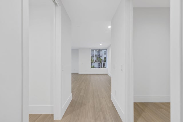 201 SE 4th Ave, Delray Beach, FL 33483 - hallway with light wood-style flooring, baseboards, and recessed lighting