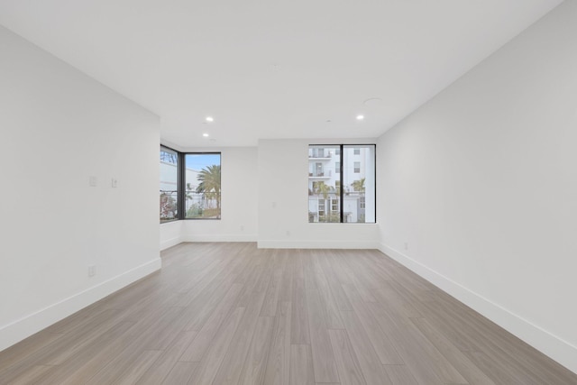 201 SE 4th Ave, Delray Beach, FL 33483 - spare room with light wood-style flooring, baseboards, and recessed lighting