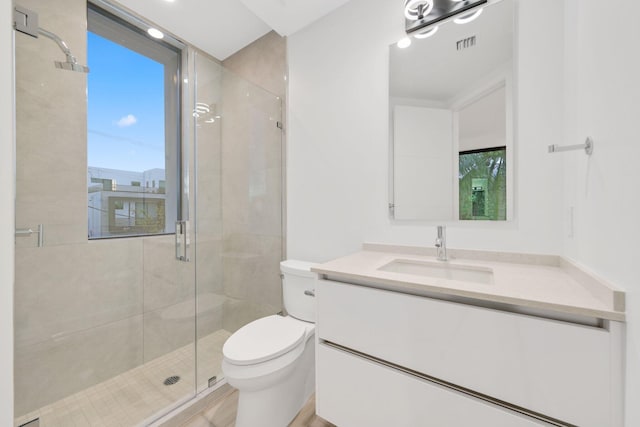 201 SE 4th Ave, Delray Beach, FL 33483 - bathroom featuring toilet, vanity, and a stall shower