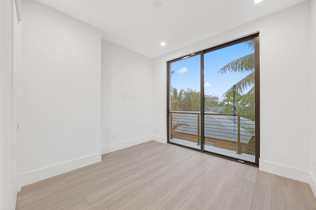 201 SE 4th Ave, Delray Beach, FL 33483 - empty room featuring baseboards, light wood-style floors, and recessed lighting