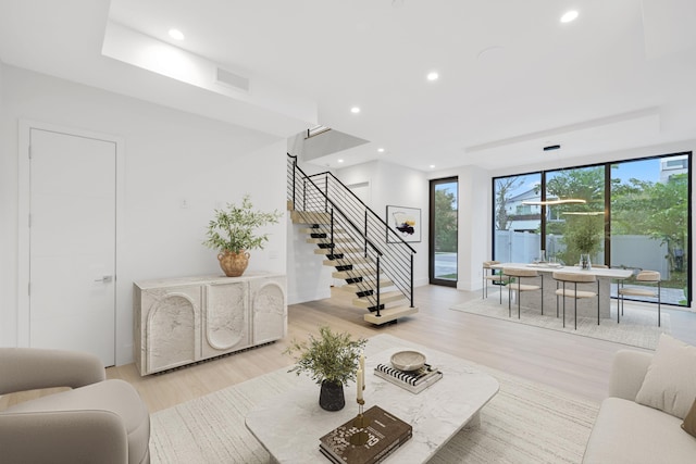 201 SE 4th Ave, Delray Beach, FL 33483 - living room with stairway, light wood-style floors, and recessed lighting