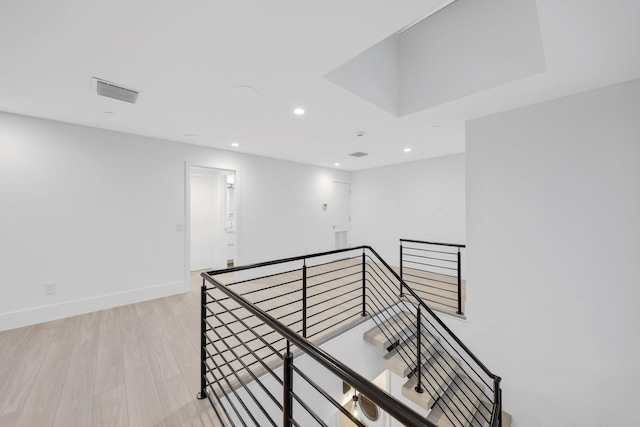 201 SE 4th Ave, Delray Beach, FL 33483 - hallway featuring an upstairs landing, recessed lighting, baseboards, and light wood-style flooring