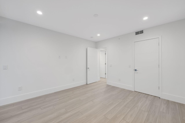 201 SE 4th Ave, Delray Beach, FL 33483 - unfurnished bedroom with light wood-style flooring, baseboards, and recessed lighting