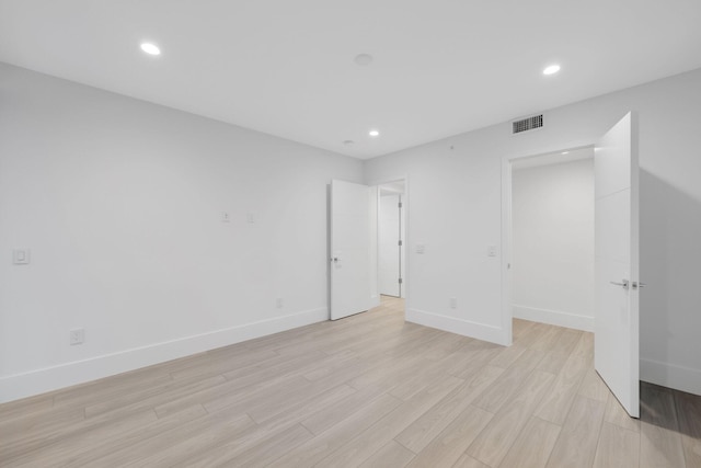 201 SE 4th Ave, Delray Beach, FL 33483 - unfurnished bedroom with light wood finished floors, recessed lighting, and baseboards