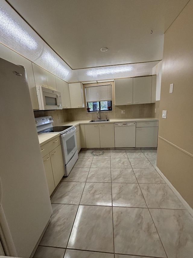 4820 Lucerne Lakes Blvd W Unit 107, Greenacres, FL 33467 - kitchen featuring white appliances, a sink, light countertops, and tasteful backsplash