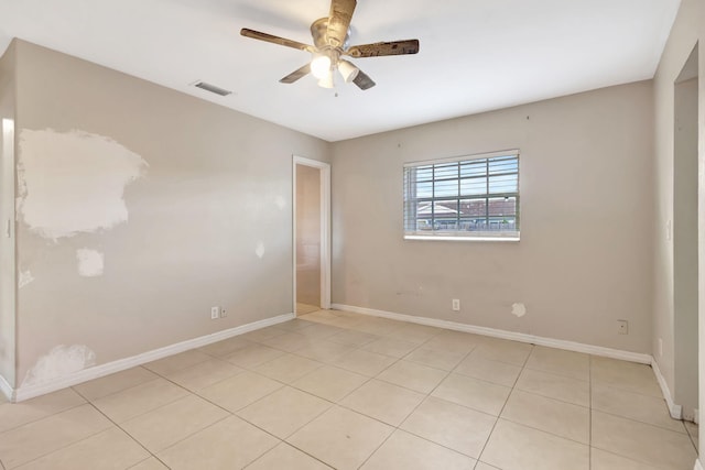 3854 Van Cott Cir, West Palm Beach, FL 33403 - spare room featuring a ceiling fan, baseboards, and light tile patterned floors