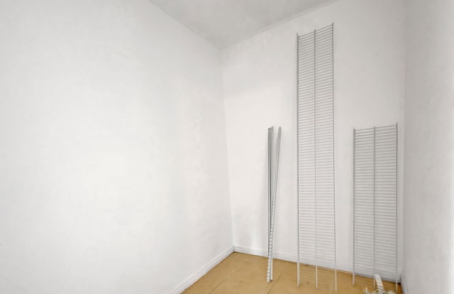 3854 Van Cott Cir, West Palm Beach, FL 33403 - unfurnished bedroom featuring light tile patterned floors