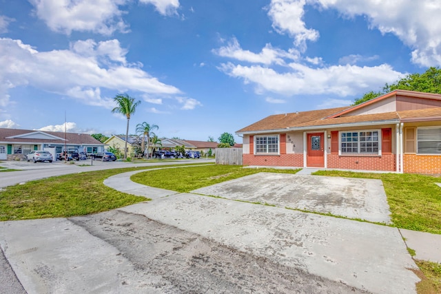 3854 Van Cott Cir, West Palm Beach, FL 33403 - ranch-style home with brick siding and a residential view