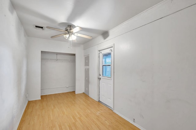3854 Van Cott Cir, West Palm Beach, FL 33403 - unfurnished bedroom featuring light wood finished floors, a closet, baseboards, and ceiling fan
