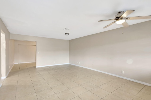 3854 Van Cott Cir, West Palm Beach, FL 33403 - unfurnished room with ceiling fan, baseboards, and light tile patterned floors