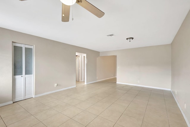 3854 Van Cott Cir, West Palm Beach, FL 33403 - empty room featuring ceiling fan, light tile patterned flooring, and baseboards