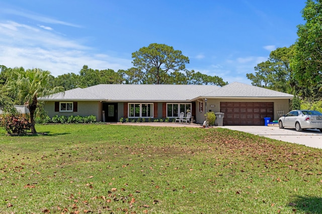 11447 Orange Grove Blvd, West Palm Beach, FL 33411 - single story home featuring an attached garage, a front yard, and concrete driveway