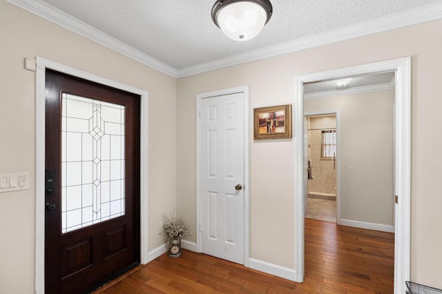 11447 Orange Grove Blvd, West Palm Beach, FL 33411 - entryway with wood finished floors, crown molding, and baseboards