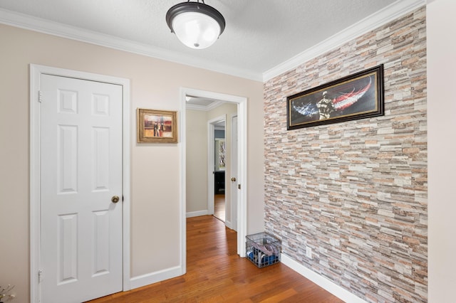 11447 Orange Grove Blvd, West Palm Beach, FL 33411 - hall with wood finished floors, baseboards, crown molding, and a textured ceiling