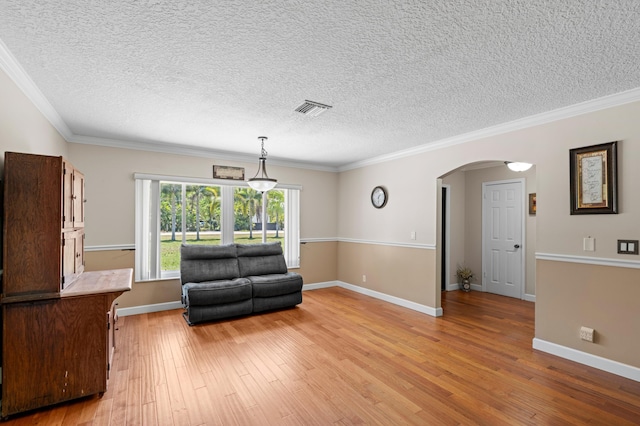 11447 Orange Grove Blvd, West Palm Beach, FL 33411 - living area featuring arched walkways, light wood-type flooring, a textured ceiling, crown molding, and baseboards