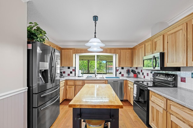 11447 Orange Grove Blvd, West Palm Beach, FL 33411 - kitchen with stainless steel appliances, light brown cabinets, and backsplash