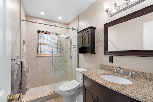 11447 Orange Grove Blvd, West Palm Beach, FL 33411 - bathroom featuring toilet, a shower stall, vanity, and recessed lighting