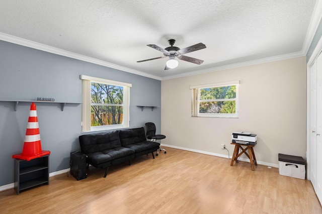 11447 Orange Grove Blvd, West Palm Beach, FL 33411 - living area with plenty of natural light, crown molding, wood finished floors, a textured ceiling, and ceiling fan