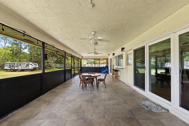 11447 Orange Grove Blvd, West Palm Beach, FL 33411 - sunroom featuring outdoor dining area and ceiling fan