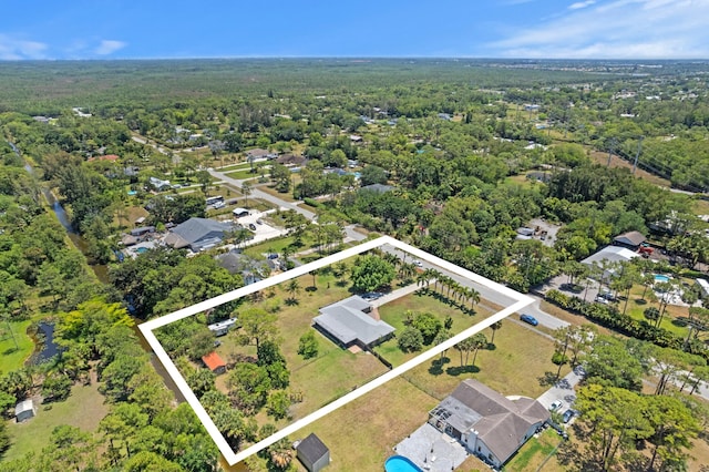 11447 Orange Grove Blvd, West Palm Beach, FL 33411 - aerial view of residential area with property boundaries highlighted and a forest