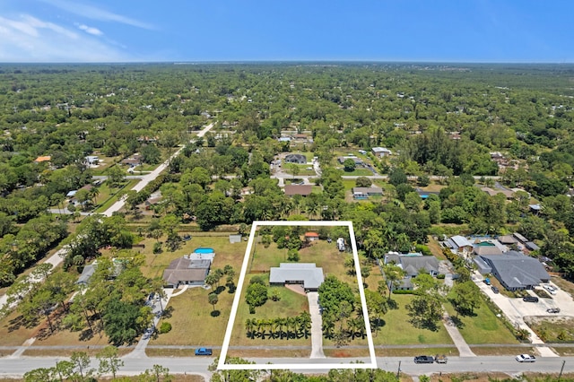 11447 Orange Grove Blvd, West Palm Beach, FL 33411 - aerial perspective of suburban area featuring property parcel outlined and a forest