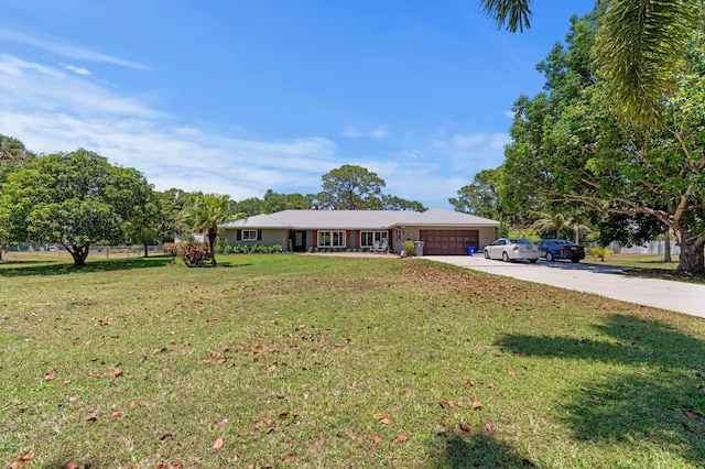 11447 Orange Grove Blvd, West Palm Beach, FL 33411 - ranch-style home featuring driveway, an attached garage, and a front lawn