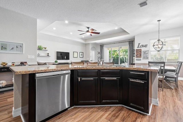 7267 Prudencia Dr, Lake Worth, FL 33463 - kitchen with dishwasher, a tray ceiling, a sink, open floor plan, and a textured ceiling