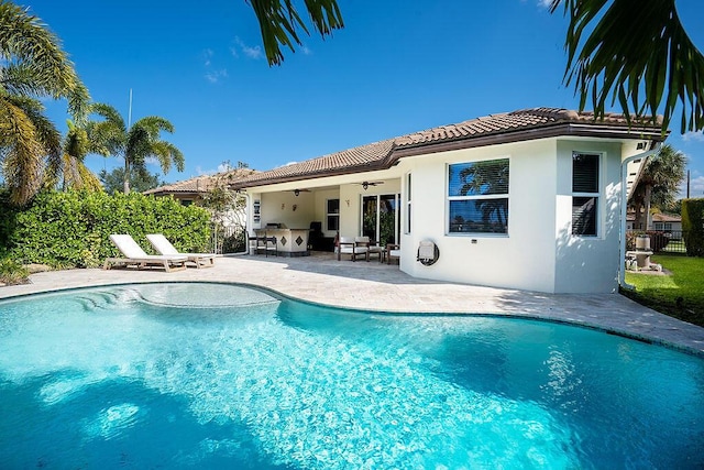 7267 Prudencia Dr, Lake Worth, FL 33463 - rear view of property featuring a ceiling fan, a tiled roof, stucco siding, and a patio area