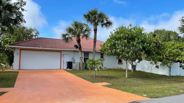 2332 SW Savona Blvd, Port Saint Lucie, FL 34953 - view of front of home with a tile roof, stucco siding, an attached garage, and driveway