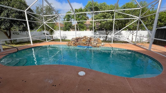 2332 SW Savona Blvd, Port Saint Lucie, FL 34953 - view of swimming pool with a fenced backyard, a lanai, and a patio area