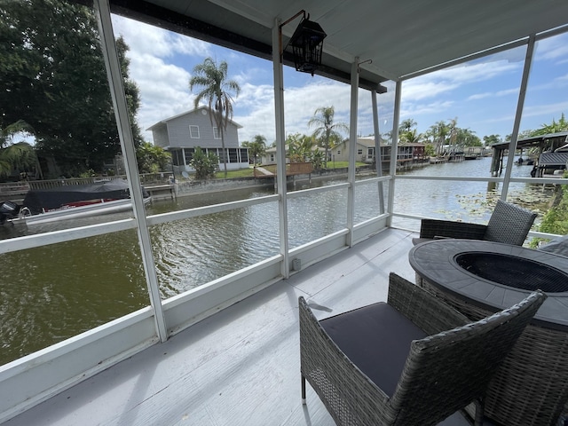 1099 7th St, Okeechobee, FL 34974 - sunroom / solarium featuring a water view
