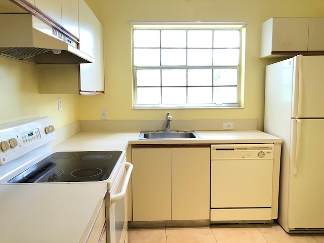 720 Cypress Ln Unit K, Deerfield Beach, FL 33064 - kitchen with white appliances, under cabinet range hood, a sink, and light countertops