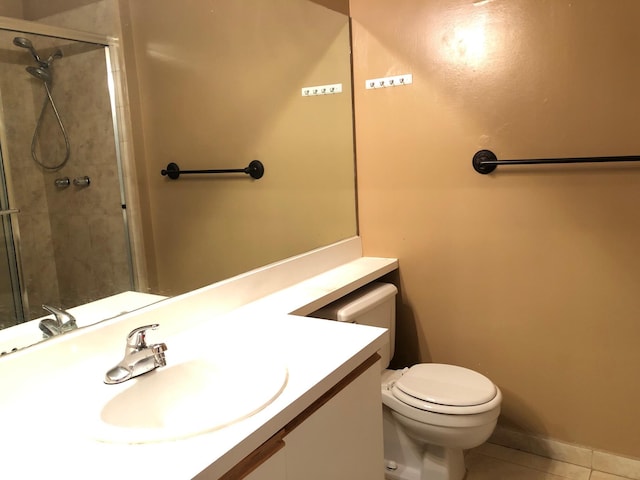 720 Cypress Ln Unit K, Deerfield Beach, FL 33064 - bathroom featuring tile patterned flooring, toilet, tiled shower, and vanity