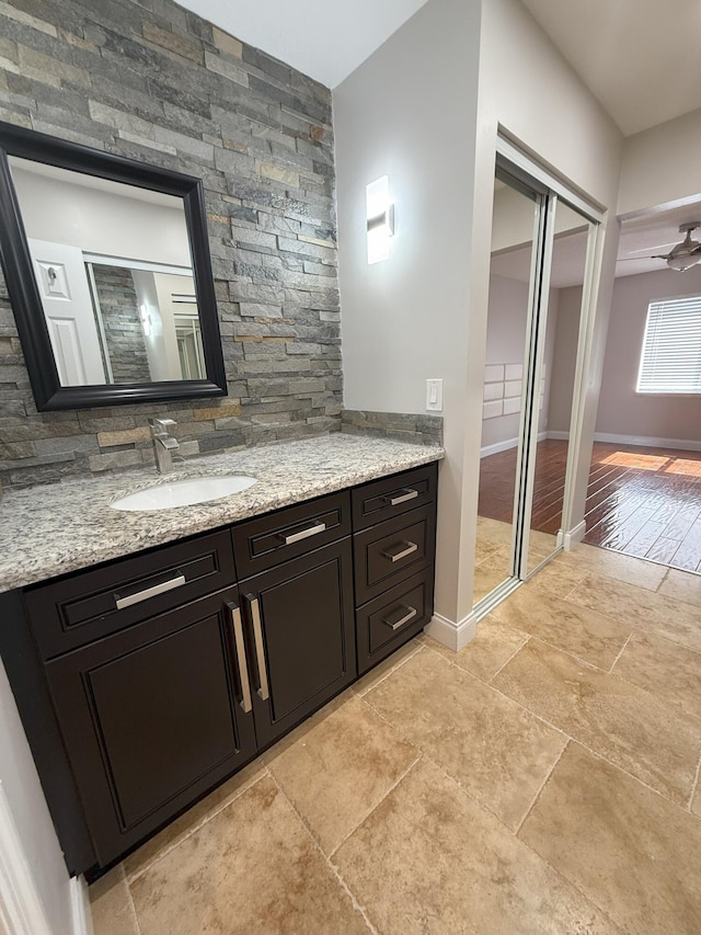310 SE 2nd Ave Unit A3, Deerfield Beach, FL 33441 - bathroom featuring baseboards and vanity