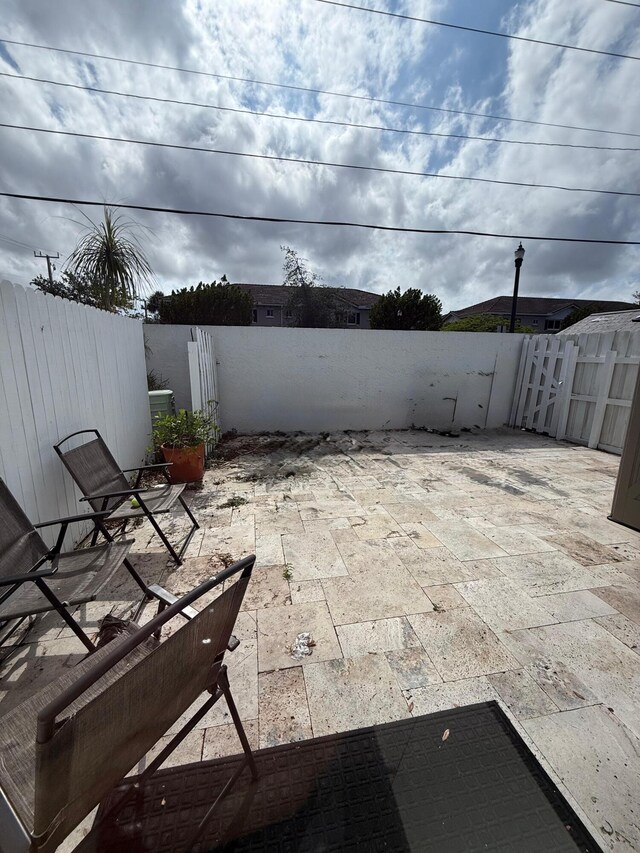 310 SE 2nd Ave Unit A3, Deerfield Beach, FL 33441 - view of patio / terrace with a fenced backyard