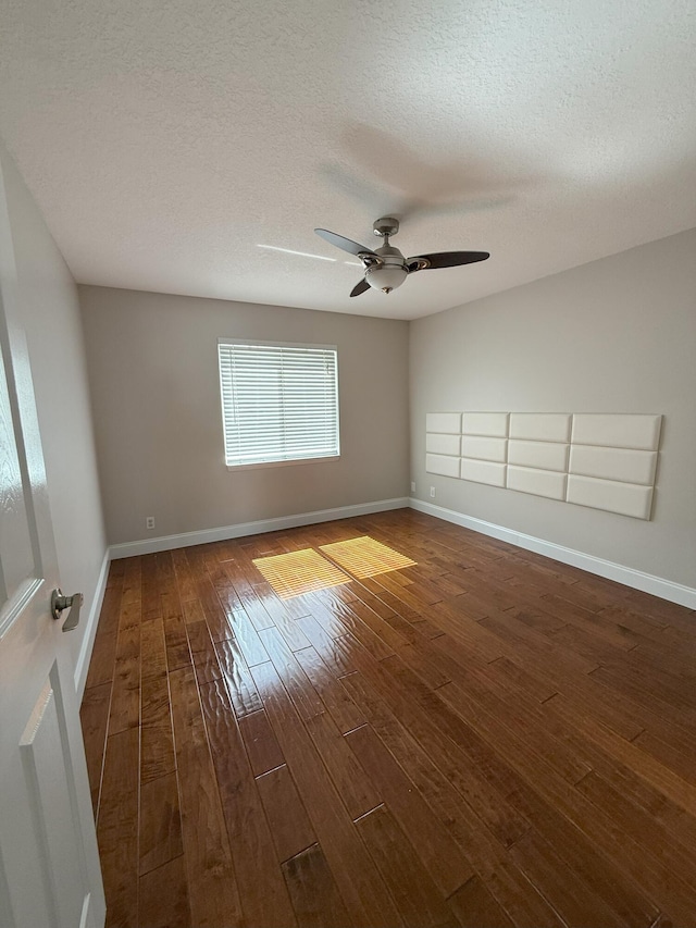 310 SE 2nd Ave Unit A3, Deerfield Beach, FL 33441 - spare room with wood-type flooring, ceiling fan, baseboards, and a textured ceiling