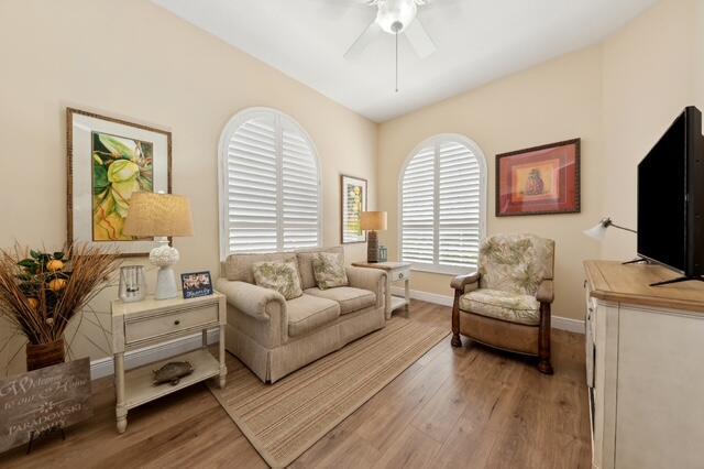 2596 Irma Lake Dr, West Palm Beach, FL 33411 - living area featuring light wood-type flooring, ceiling fan, and baseboards