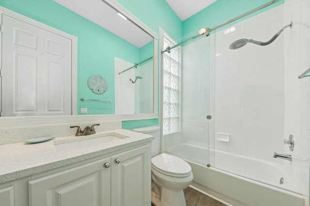 2596 Irma Lake Dr, West Palm Beach, FL 33411 - bathroom with toilet, vanity, combined bath / shower with glass door, and wood finished floors