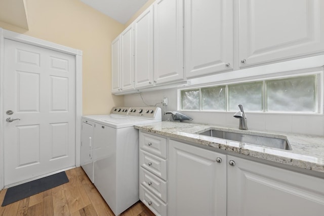 2596 Irma Lake Dr, West Palm Beach, FL 33411 - laundry area with separate washer and dryer, cabinet space, and light wood-type flooring
