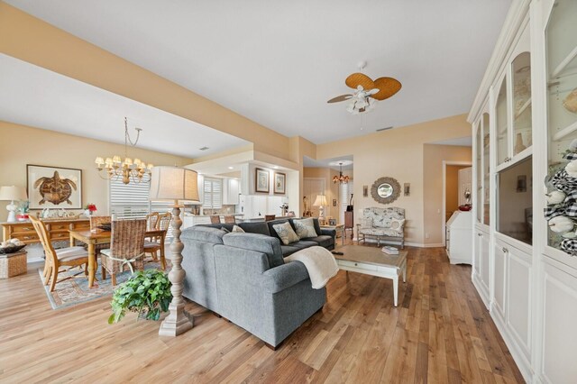 2596 Irma Lake Dr, West Palm Beach, FL 33411 - living area with a chandelier, light wood-type flooring, and a ceiling fan