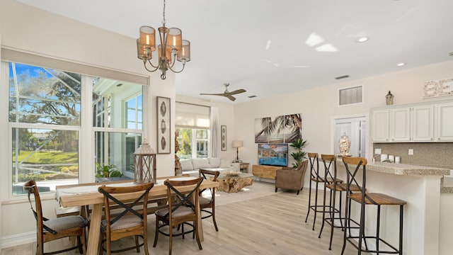 6193 Winding Lake Dr, Jupiter, FL 33458 - dining space with light wood finished floors, a chandelier, ceiling fan, recessed lighting, and baseboards