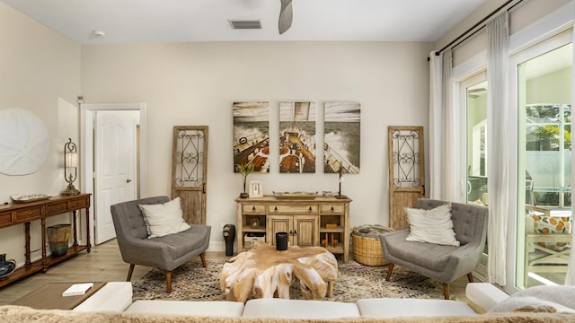 6193 Winding Lake Dr, Jupiter, FL 33458 - living area with light wood finished floors and ceiling fan