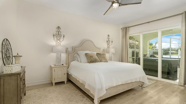 6193 Winding Lake Dr, Jupiter, FL 33458 - bedroom featuring access to exterior, light wood-style flooring, baseboards, and a ceiling fan