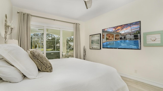 6193 Winding Lake Dr, Jupiter, FL 33458 - bedroom with wood finished floors, access to outside, baseboards, and a ceiling fan
